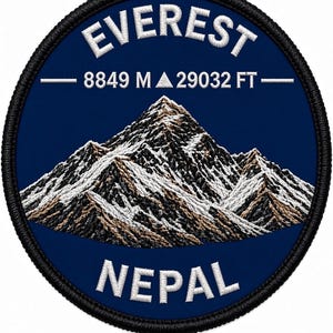 May include: A circular embroidered patch with a dark blue background featuring a detailed mountain peak in white, grey, and brown thread. The text EVEREST is arched at the top, with 8849 M 29032 FT in the centre and NEPAL at the bottom.