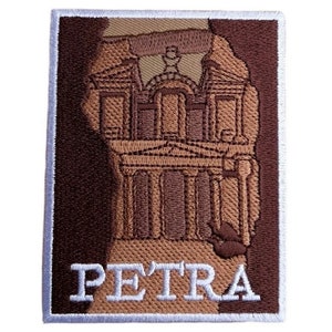 May include: Embroidered patch featuring a brown and tan image of the Treasury building in Petra, Jordan. The patch has a white border and the word "PETRA" is embroidered in white below the image.