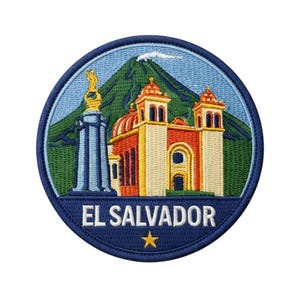 May include: Embroidered patch featuring a detailed depiction of El Salvador. The design includes a church, a monument, and a volcano, all set against a blue sky. The text "EL SALVADOR" is prominently displayed, with a gold star below.