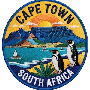 May include: Embroidered patch featuring a scenic view of Cape Town, South Africa. The design includes a mountain range, ocean, sailboats, and two penguins. The text "CAPE TOWN" and "SOUTH AFRICA" are prominently displayed.