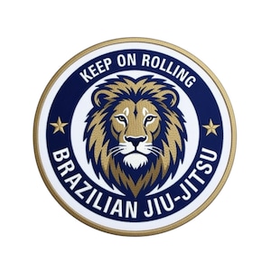 May include: A circular patch with a lion's head in gold and brown, surrounded by a navy blue ring with the text "KEEP ON ROLLING" and "BRAZILIAN JIU-JITSU" in white. Two gold stars are on either side of the lion.