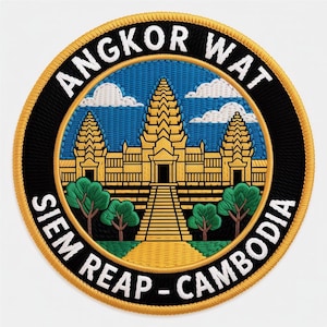 May include: Embroidered patch depicting the Angkor Wat temple in Cambodia. The design features a yellow temple, green trees, a blue sky with clouds, and the text "ANGKOR WAT SIEM REAP - CAMBODIA" in white lettering on a black and gold border.