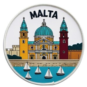 May include: A round patch featuring the word "MALTA" above a detailed illustration of a Maltese landmark. The image includes a church with a blue dome, yellow and red towers, and sailboats on a blue sea. The patch has a white border.