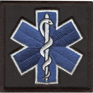 May include: A blue and white embroidered medical star of life patch with a white caduceus in the center. The patch is on a black background.
