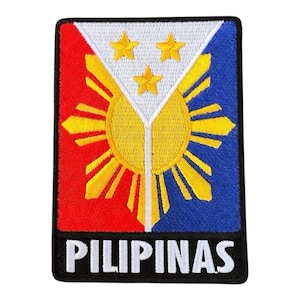 May include: Embroidered patch featuring the flag of the Philippines. The design includes a white triangle with three yellow stars, a yellow sun, and red and blue fields. The word "PILIPINAS" is embroidered in white on a black background.