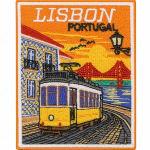 May include: A rectangular embroidered patch featuring a yellow tram on cobblestone tracks in Lisbon, Portugal. The scene includes a blue and white tiled building, a red suspension bridge, a black street lamp, and the text LISBON PORTUGAL.