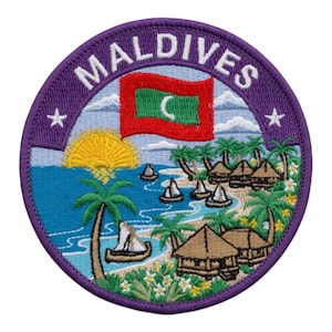 May include: Embroidered patch featuring a tropical island scene with the text "MALDIVES" in white lettering on a purple border. The design includes a flag, sun, palm trees, boats, and huts, evoking a vacation theme.