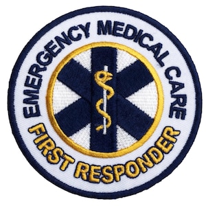 May include: Circular patch with the words "EMERGENCY MEDICAL CARE FIRST RESPONDER" in white and gold lettering. The center features a blue and gold medical symbol with a staff and serpent.