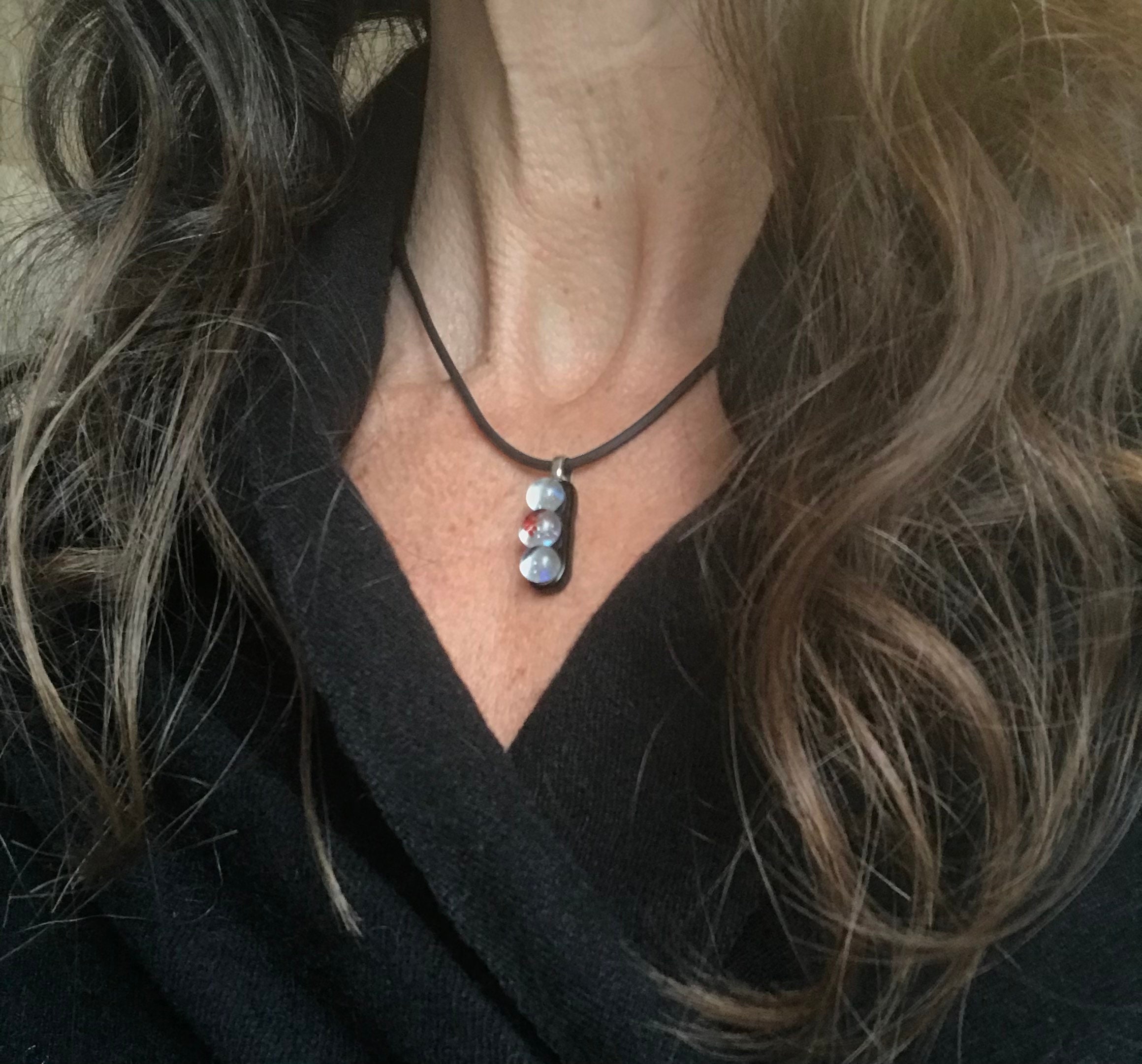 Black With Clear Orbs Fine Silver Fused Glass Pendant on a