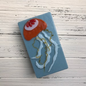 Jellyfish Hand-crafted Orange, White, and Red Glass Night Light on Powder Blue Glass