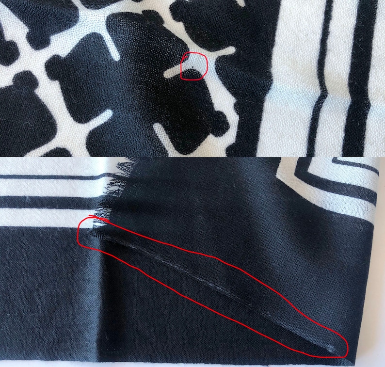 May include: Black and white patterned scarf. The top portion features a repeating pattern of black shapes on a white background. The bottom portion has black and white stripes and a fringed edge.