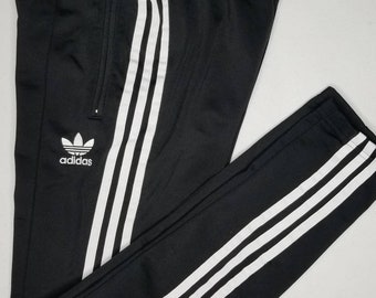 the brand with the three stripes pants