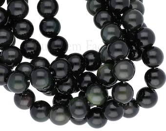 May include: A strand of black obsidian beads with a slight iridescent sheen. The beads are round and smooth, and they are strung on a clear thread.