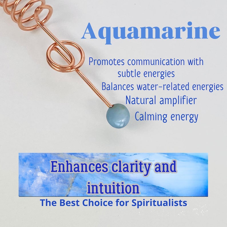 May include: A copper-colored wand with a light blue aquamarine stone at the tip. The word "Aquamarine" is displayed in blue text, along with text that reads "Promotes communication with subtle energies" and "Enhances clarity and intuition."