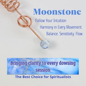 May include: A copper-colored dowsing rod with a blue and white moonstone at the tip. The text "Moonstone" and other phrases are displayed in blue. The text includes "Follow Your Intuition" and "Bringing clarity to every dowsing session."