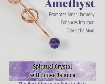 May include: A copper-colored wand with a spiral design and a small, round, purple amethyst crystal at the end. Text on the image reads "Amethyst" and "Spiritual Crystal with Inner Balance."