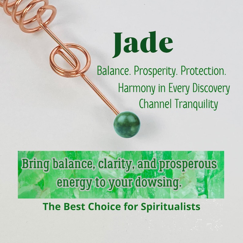 May include: A copper dowsing rod with a green jade sphere at the end. The word "Jade" is displayed in green text, along with text about balance, prosperity, and harmony. The text "Bring balance, clarity, and prosperous energy to your dowsing" is also visible.