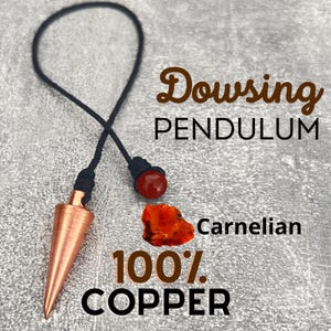 May include: A copper dowsing pendulum with a carnelian crystal on a black cord. The pendulum is 100% copper and is used for divination and energy work.  The text "Dowsing Pendulum" and "Carnelian" are visible in the image.