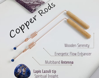 May include: Two copper rods with a coiled section and blue lapis lazuli tips. The rods are labeled "Copper Rods" and have wooden handles labeled "Wooden Serenity, Energetic Flow Enhancer, Multiband Antenna". The text "Lapis Lazuli tip, Spiritual Insight" is also included.