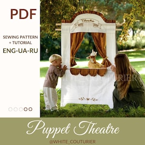 May include: A white puppet theater with brown curtains and a banner that says "Theatre". A child and an adult are watching a puppet show. The image also includes the text "PDF", "SEWING PATTERN + TUTORIAL", and "Puppet Theatre".