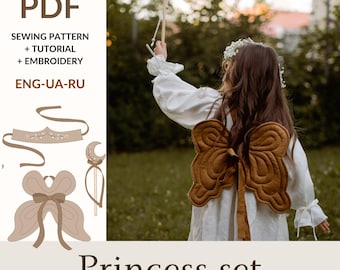 May include: PDF sewing pattern for a princess costume set, including a crown, wings, and wand. The pattern includes instructions for embroidery and a tutorial. The pattern is available in English, Ukrainian, and Russian.