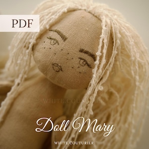 May include: A handmade fabric doll with light tan skin, embroidered facial features, and long, textured off-white yarn hair. The image includes text reading PDF, Doll Mary, WHITE.COUTURIER, and ENG-UA-RU, indicating a digital pattern document.