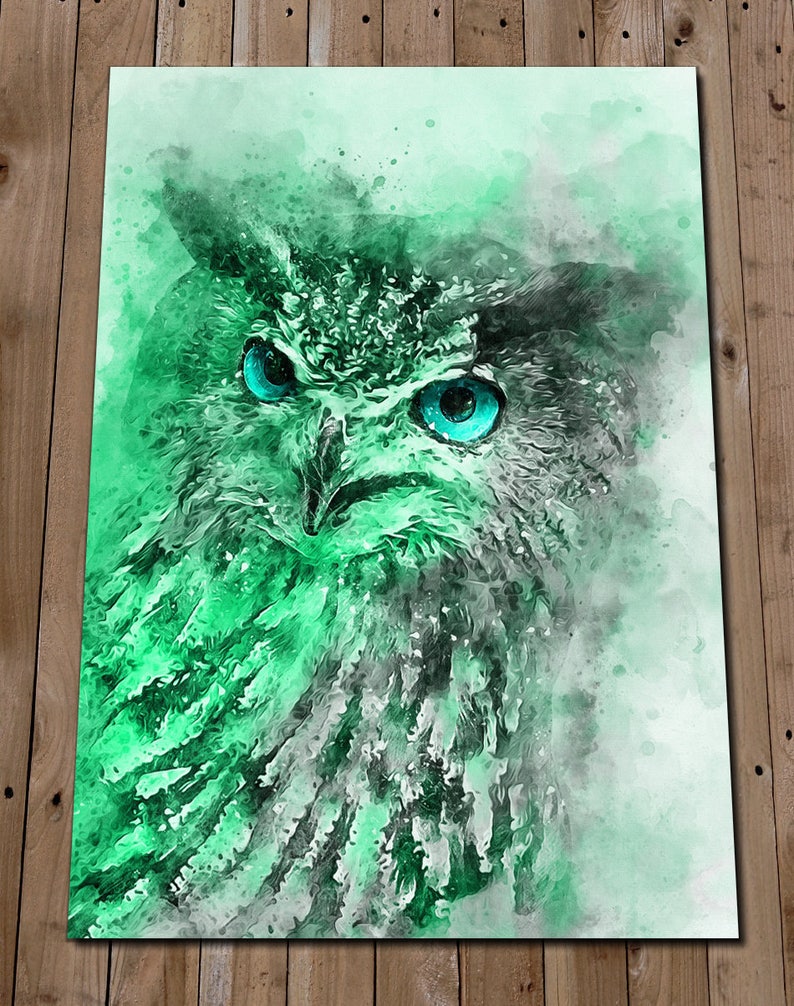 May include: A watercolour painting of an owl with bright blue eyes. The owl is rendered in shades of green and white, with a soft, ethereal background.