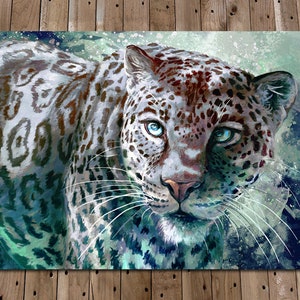 May include: A close-up of a white leopard with blue eyes. The leopard's fur is patterned with black spots and has a white background. The background is a blurry blue and green watercolor wash.