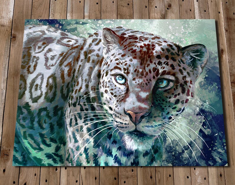 May include: A close-up of a white leopard with blue eyes. The leopard's fur is patterned with black spots and has a white background. The background is a blurry blue and green watercolor wash.