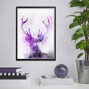 May include: A framed watercolor painting of a purple deer with antlers against a white background. The deer's antlers are large and spread out, and the deer's body is partially obscured by the antlers.