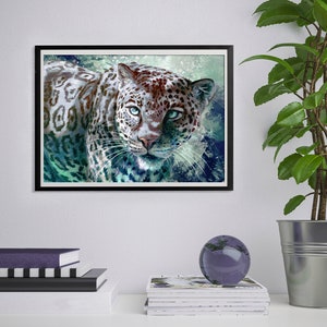 May include: A white jaguar with brown spots and blue eyes stares directly at the viewer. The jaguar is set against a blue and green watercolor background.