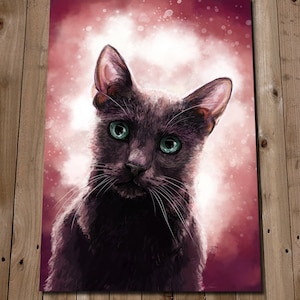 May include: A black cat with green eyes stares directly at the camera. The cat is in focus, while the background is a soft, pink and white watercolor wash.