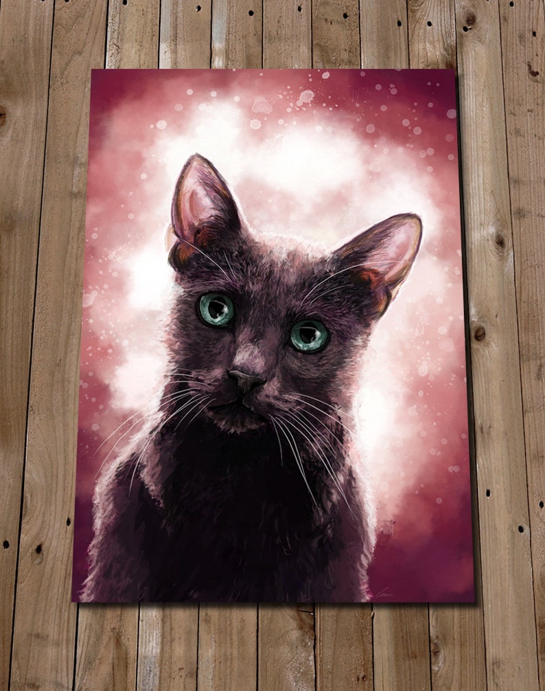 May include: A black cat with green eyes stares directly at the camera. The cat is in focus, while the background is a soft, pink and white watercolor wash.