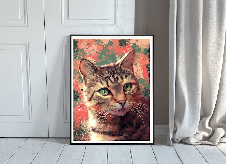 May include: A close-up portrait of a tabby cat with green eyes. The cat is looking directly at the viewer. The background is a colorful abstract design with splashes of red, orange, green, and blue.