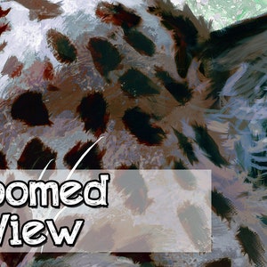 May include: Close-up of a brown, black, and white animal print fabric. The fabric has a soft, fuzzy texture and is perfect for a variety of crafting projects.