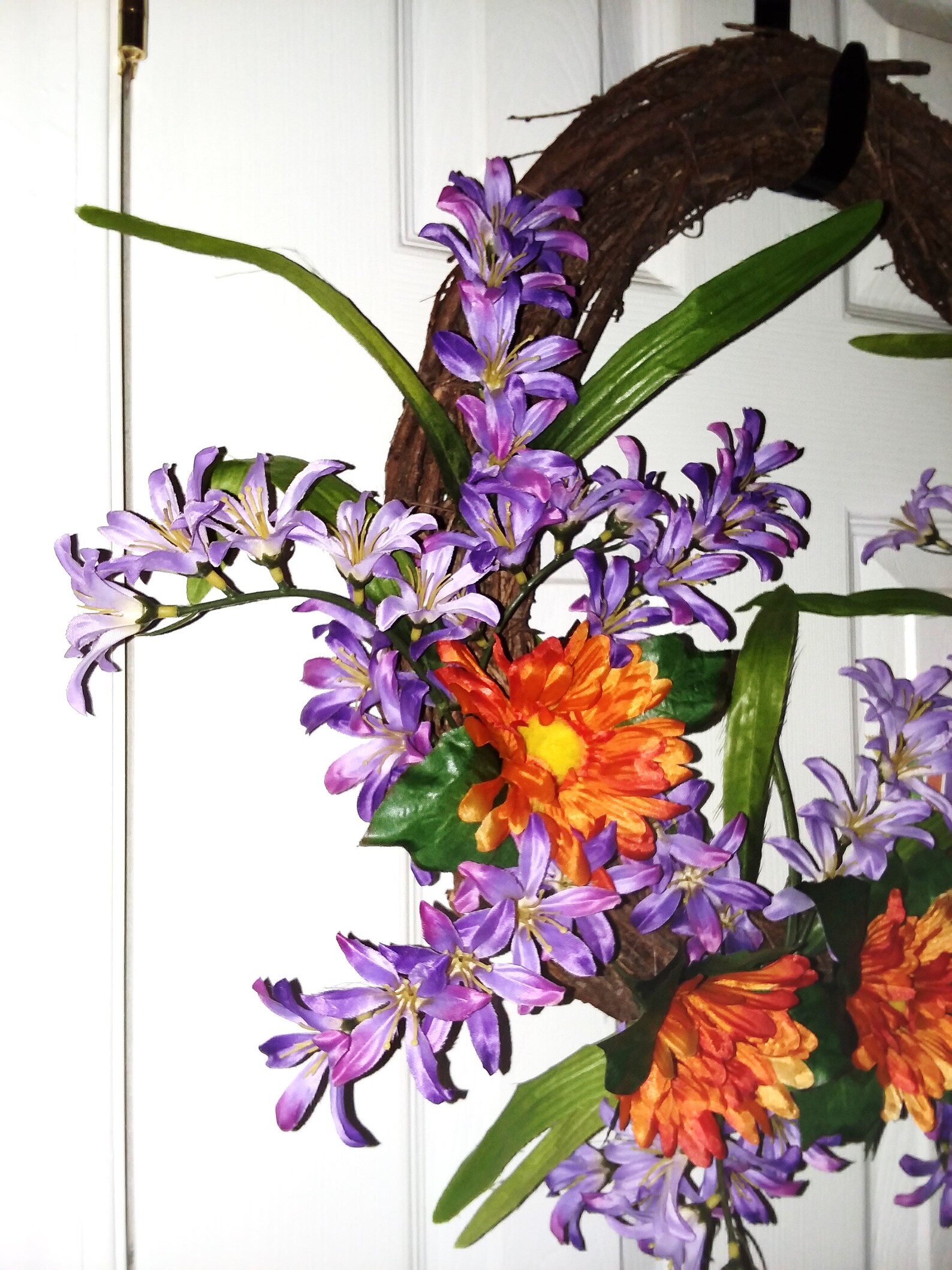 Grapevine Spring wreath with freesia and daisies grapevine