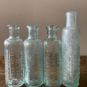 4 Antique Aqua Apothecary Bottles Miller’s Haynes’ Arabian Balsam + Mrs. Winslow’s Soothing Syrup