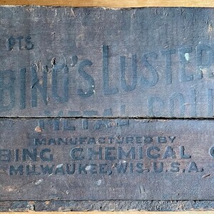 May include: A wooden box with black lettering that reads "1007 PTS.  Fiebings LUSTRE  METAL POLISH  MANUFACTURED BY  FIEBING CHEMICAL CO.  MILWAUKEE, WIS. U.S.A."