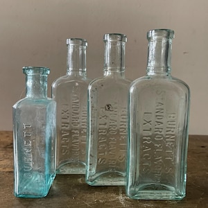 4 Antique Aqua Bottles Burnetts Extract