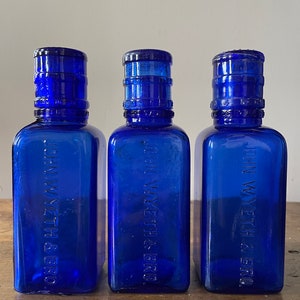 John Wyeth Colbalt Bottle & Dosage Cup