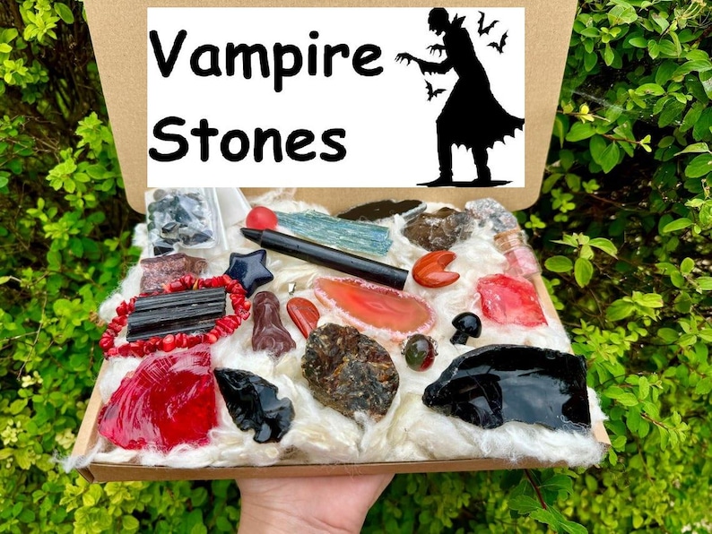 May include: A box filled with various crystals and stones, including black obsidian, red agate, and clear quartz. The box is labeled "Vampire Stones".