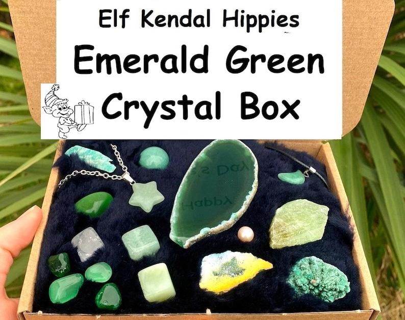 May include: A box filled with green crystals and a silver necklace with a star charm. The box is labeled "Elf Kendal Hippies Emerald Green Crystal Box".