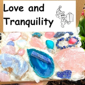 May include: A box filled with various pink, blue, and white crystals and stones. The box is labeled "Love and Tranquility".