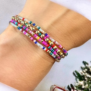 14k gold filled and multicolored seed bead stacking stretch bracelets.