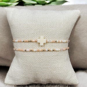 14k gold filled seed bead stacking bracelets with cream/off white cross.