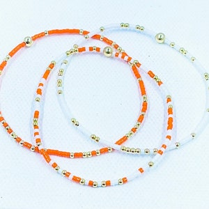 Orange and white seed bead bracelets. Great for Tennessee GameDay, great for stacking, go Vols! Perfect graduation gift.