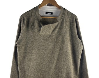 Né-net gebreide trui met asymmetrische kraag Japanse designer