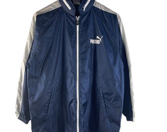 Vintage Puma hardloopwindjack met opvouwbare capuchon marineblauw