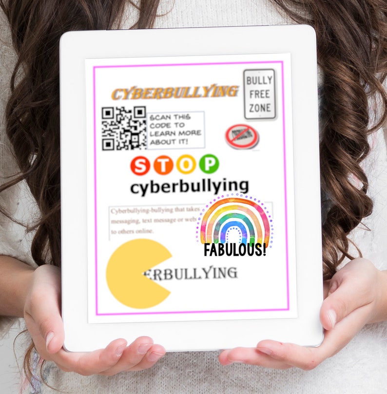 May include: A tablet screen displaying a poster with the words "Cyberbullying" and "Stop cyberbullying". The poster has a QR code, a rainbow, and a Pac-Man graphic. The text "Bully Free Zone" is in a red box at the top of the poster.