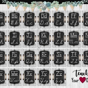 May include: A set of twenty-six rectangular cards featuring the alphabet in both uppercase and lowercase cursive script on a black chalkboard background with a white wood grain border and a decorative banner with the text Teach Your Heart Out.